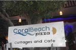 Coral Beach Pizza Cottages